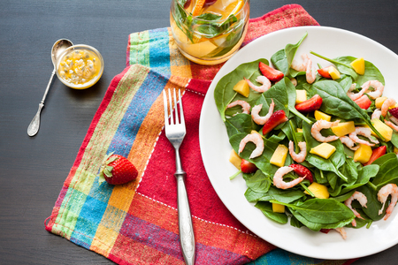 Fresh spinach fruit salad.の写真素材