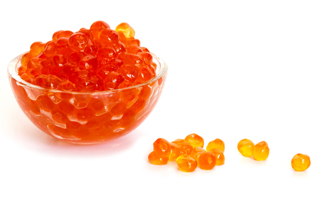 Red caviar in the glass bowl isolated on a white background.の写真素材