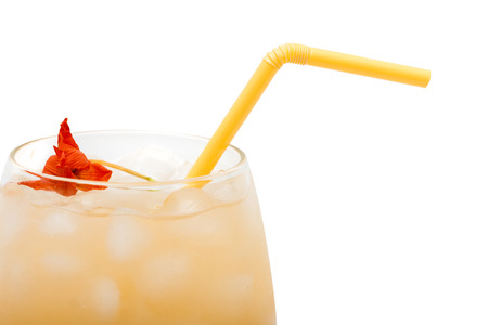 Glass of juice with ice on a white background.の写真素材