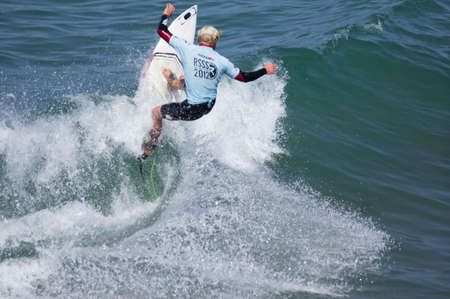 Pacific Beach, San Diego Revolt Summer Surf Series 6.0 08/17/2012 - surfer jumping a waveのeditorial素材