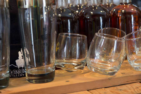 Breckenridge Distillery, 01/26/2013 - Glasses and Bourbob Whiskey Bottlesのeditorial素材
