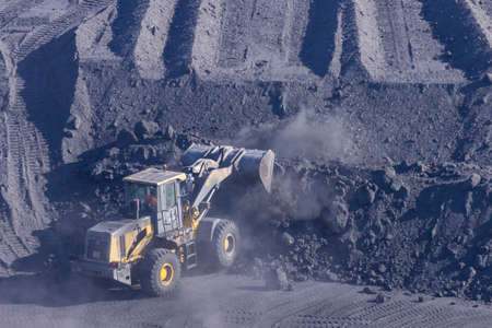 Vladivostok, Russia - January, 28, 2018: Transfer of coal from railway cars to a ship in the port of...