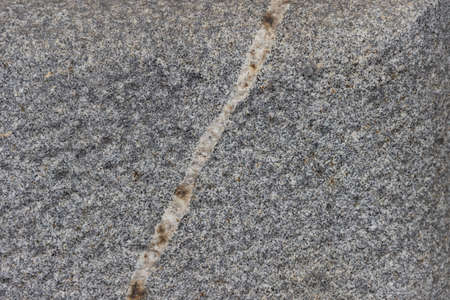 The texture of a natural stone slab from polished granite.の写真素材