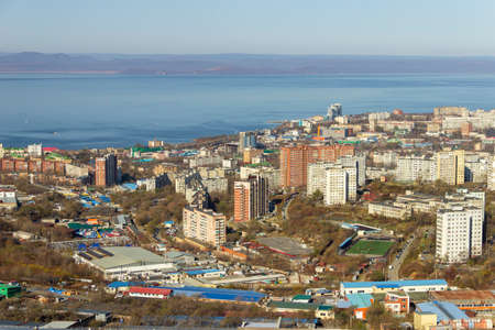 Vladivostok, Russia - October, 27, 2019: View of the industrial and residential areas of Vladivostok from the top of the Kholodilnik Hill.の写真素材