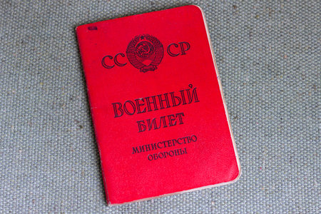 St. Peterburg, Russia - December, 24, 2020: Soviet military ID, lying on a tarp.