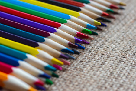 Set of colorful pencils on burlap.の写真素材