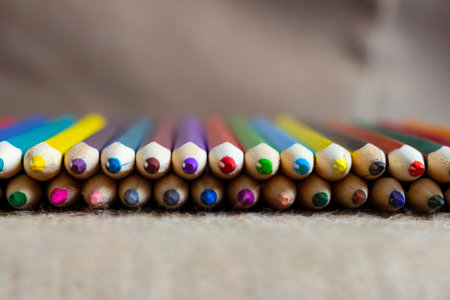 Set of colorful pencils on burlap.