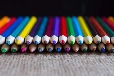 Set of colorful pencils on burlap.の写真素材