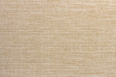 The texture of light beige variegated fabric, in small stripes.の写真素材