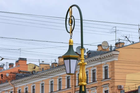 Street lights on the Green Bridge over the Moika River on Nevsky Prospekt. Beautiful decorative green lanterns with white glass edged with gold-colored metal.の写真素材