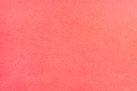 A sheet of colored paper with a non-uniform color. Neutral paper texture.