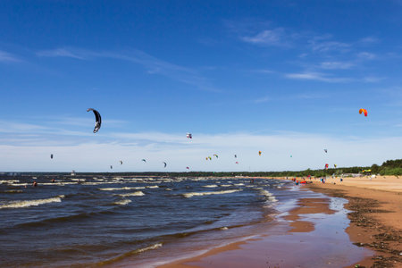 St. Petersburg, Russia - June, 13, 2021: Kitesurfers on the shore of the Gulf of Finland on a windy summer day. Active sports in the vicinity of St. Petersburgのeditorial素材