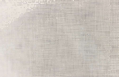 An uneven, ragged grid with small cells. Abstract rough texture with spots and stripes.の写真素材