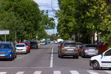 St. Petersburg, Russia - June, 24, 2021: A quiet street in St. Petersburg, overgrown with trees on a clear summer day.のeditorial素材