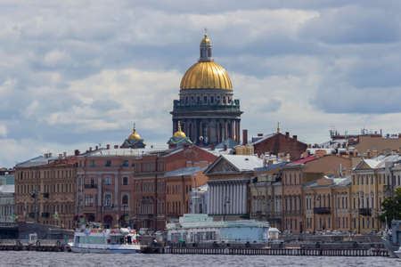 St. Petersburg, Russia - June, 24, 2021: The golden dome of St. Isaac's Cathedral, sparkling in the...
