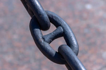 An old rusty chain with peeling paint. Ship chain in the fence on the embankment of St. Petersburg.の写真素材