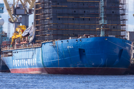 St. Petersburg, Russia - July, 24, 2021: The nuclear icebreaker of Rosatomflot "Ural" under construction at the berth of the Baltic plant.のeditorial素材