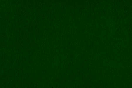 Dark non-uniform paper with spots and inclusions. Paper texture with fibers and dots.の写真素材