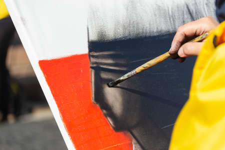 St. Petersburg, Russia - Sptember, 05,2021: The hand of a street artist painting a picture.のeditorial素材