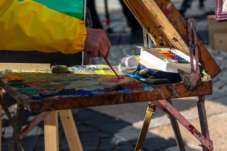 St. Petersburg, Russia - Sptember, 05,2021: The hand of a street artist painting a picture.のeditorial素材