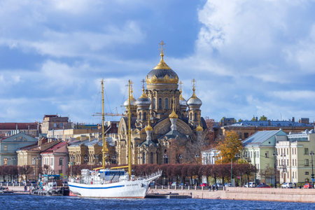 St. Petersburg, Russia - October, 17, 2021: White sailboat on the embankment near the Assumption courtyard of the Vvedensky monastery Optina Deserts.のeditorial素材