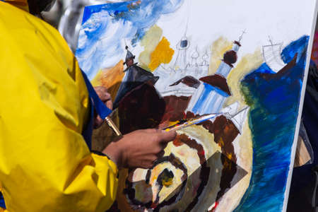 St. Petersburg, Russia - Sptember, 05,2021: The hand of a street artist painting a picture.のeditorial素材