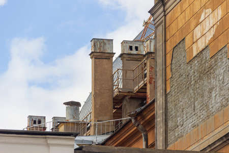 Chimneys on old buildings in St. Petersburg. Heating systems with coal and wood.の写真素材