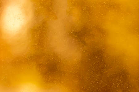 The surface of a window pane stained and streaked by dried raindrops. Blurred texture with smooth transitions.の写真素材