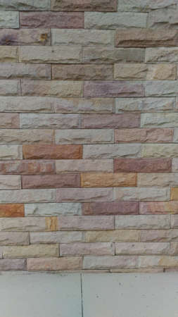 This is wall tiles stone.  Are color tone cream or brick. Vertical Pictureの写真素材