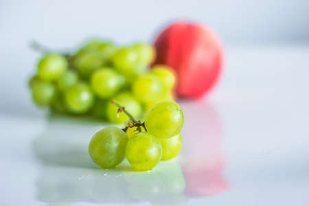 Green grapes on the tableの写真素材