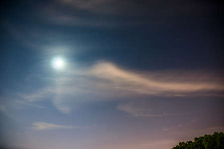 Landscape scenery view of a moon in the night skyの写真素材
