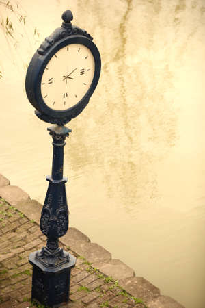 Time standing at the riverside streetsの写真素材