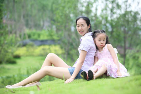 family photos in the park, mother and daughterの写真素材