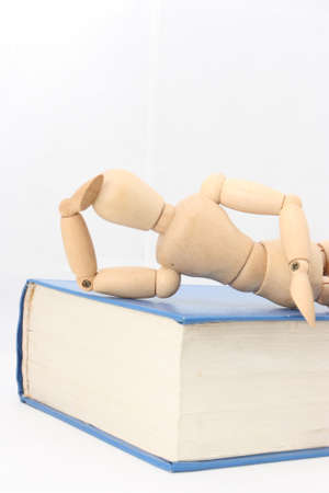 The relationship between the puppet and bookの写真素材