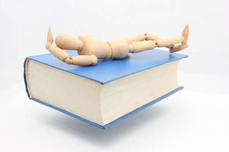 The relationship between the puppet and bookの写真素材