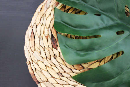 Background of a plant and a braided plateの写真素材