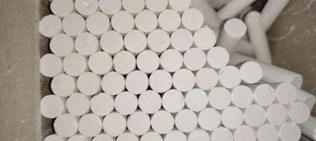 Pile of white chalks. Close-up. Selective focus.