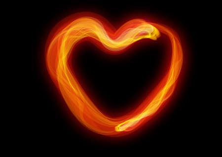 red burning heart, the dark background.の写真素材