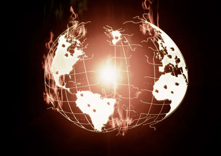 Burning earth, the outbreak of war, the earth in a disastrous state, in the center of the fire burning の写真素材