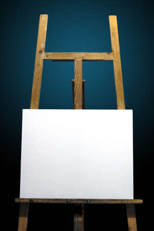 Cloth white wooden easel painting placing, under the deep blue background の写真素材