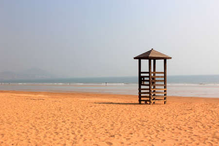 A watch tower stands on the beachの写真素材