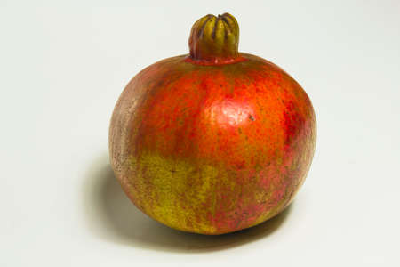 Pomegranate mature white background.