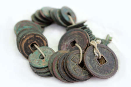 Metal coins of white background always Chinese ancient overgrown with patinaの写真素材