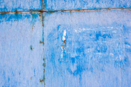 Blue paint mottled weathered rusty iron sheet