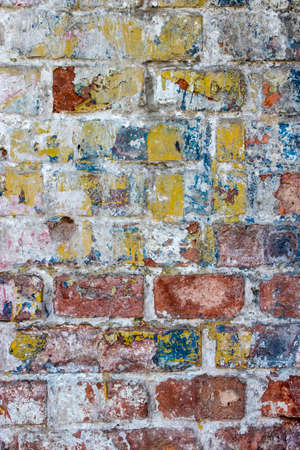 Mottled colors covered with scratches stained wall close-upの写真素材