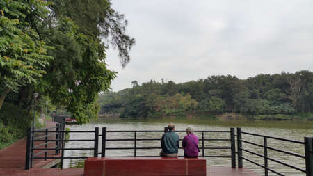 old couple sitting beside to each other