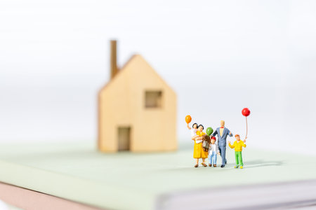 Young parents with three children miniatureï¼ miniature conceptの写真素材