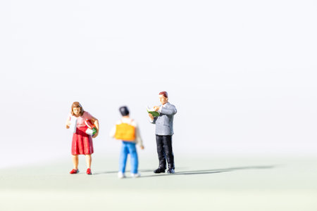 Back view of teacher and a student with schoolbagの写真素材