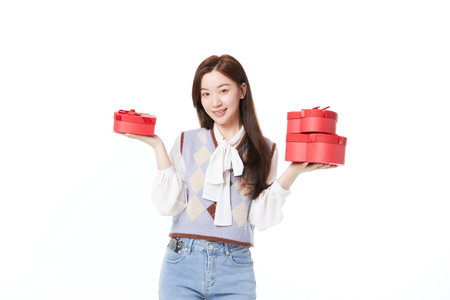 beautiful woman holding gift boxの写真素材