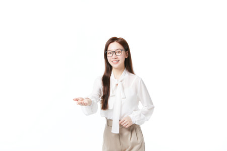 Teacher stretches out hand to ask classmates to answer questionsの写真素材